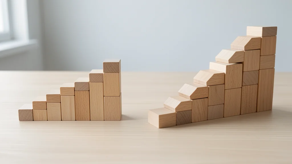 Two separate stair-like structures built from plain wooden blocks on a light wooden tabletop